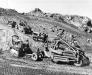 Seabees with the 62nd Naval Construction Battalion work around the clock to build an airstrip and camp areas on Iwo Jima in March 1945.
(U.S. Navy Seabee Museum photo)