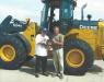 Mr. Pratt (R) presents a customer with the John Deere Gold Key Plaque at the John Deere Davenport works plant in Davenport, Iowa, in 2004.