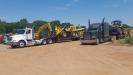 Gibson Heavy Haul transports Komatsu wheel loaders to a job site in Texas on behalf of Kirby-Smith Machinery.