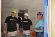 (L-R): Billy Igo, director of parts and service of Doggett, and Tim Holmes, general manager of Doggett’s Houston branch, discuss some interior work with Habitat for Humanity superintendent Patrick Ramb.
