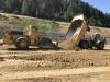 Kerr Contractors, Woodburn, Ore., began excavation work in May with 30-to-40-yd. off-road dump trucks hauling 18,000 truck loads of material.

