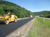 Contractors place an asphalt layer on top of the base, creating a new road with years of service for the driving public.
