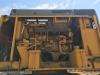 A Komatsu PC1100, before (L) and after repowering.
