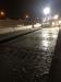 A section of road has been prepared for night-time paving operations.
