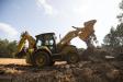 All models in the new backhoe loader line feature standard four-wheel drive with rear differential lock for improved traction in poor ground conditions.