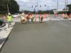 Paving efforts along one of the 11 bridges rehabbed and lifted by Massana Construction.