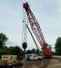 A new Manitowoc 11000 crawler being delivered at a job site in Ulster County to replace a Highway 209 bridge over Rondout Creek in Accord, N.Y.. A Grove RT 650 is in the background.