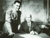 E.W. (R) and P.E. MacAllister sign the Caterpillar contract June 2, 1945.
