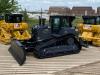 The 175,000th commemorative D6 XE dozer, with two medium dozers in traditional Cat yellow.