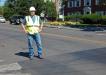 Lexington Town Engineer John Livsey stands at threshold of fog seal to rear, and double micro surfacing (