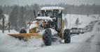 This is the scene on many Texas highways as operators work to clear snow off the road.
