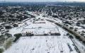 An aerial view of Houston covered in snow.