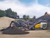 Keestrack R3e mobile impact crusher for aggregates and recycling applications with advanced innovative diesel/electric drive with plug-in functionality.
