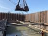 Construction crews are currently excavating the cofferdam with a crane and clam bucket on the east side of the existing North Hero-Grand Isle bridge.