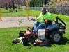 Seasonal Laborer Carl Lawrenz mows a lawn in the village of Brockport.