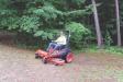 Getting ready for the summer beach season at Postwood Park, summer help Michael Keleher mows with a new Kubota mower.