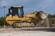 Construction crews from JR?Demolition and Excavating utilize a Cat 963 front end loader for a 144,000 sq.-ft. demolition project in South Irving, Texas.