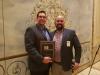 The Presidential Plaque was presented to Jason Zeibert (L) of Finkbiner Equipment Company by Adam Salinas of Illinois Truck & Equipment.