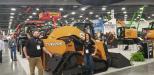 Nathaniel Waldschmidt (L), product manager of Case, and Jessica Klein, marketing manager, show off the new Case TV620B, the largest compact track loader ever built. Features include a rated operating capacity of 6,200 lbs.; breakout force of 12,907 lbs.; and bucket capacity of 12,084 lbs.
