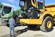Ken Romeo shows the ease of service and essential maintenance points from the ground for the Volvo A45G articulated hauler to this potential customer.