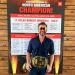The championship fully equipped the winner with a custom-made championship wrestling belt and wrestling must-have: Pit Vipers. Matthew Sobacki, Bobcat sales manager, shows off the prize. 