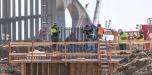 Crews will build a cable-stayed bridge and demolish some parts of the incomplete 514-ft.-tall bridge towers purposed to carry the weight of the span, as well as the rebuilding of these towers with additional steel reinforcement.