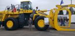 Rob Bias, vice president of marketing of Modern Machinery, Kent, Wash., with its massive Komatsu WA600 loader and Young attachment. This new attachment was completed just prior to the OLC Show, said Bias. 
