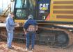 A Cat 336E about to go on the block had Gene Mauldin (L), Mauldin Excavation, Doerun, Ga., and Lester Baird, retired, deep in discussion and thought.  