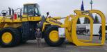 Rob Bias, vice president of marketing of Modern Machinery, Kent, Wash., with its massive Komatsu WA600 loader and Young attachment. This new attachment was completed just prior to the OLC Show, said Bias. 
