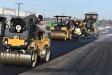 The two Caterpillar rollers and Caterpillar paver work together.
(CEG photo)