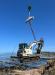 Crews lower a Geax DTC40 piling rig onto the beach.
(Photo courtesy of Granite Construction)