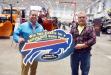 Teddy McKeon (L), N.Y.S. Highway & Public Works Expo show manager, presents Mark Savage of the town of Theresa highway department the grand prize of two tickets to the Buffalo Bills vs. the New England Patriots.