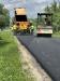 The crew performs paving work in the town of Sullivan.