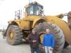 John Stevens (L) and Chris Johnson, both of Franks Excavating, inspect this Cat 990 wheel loader.
 