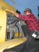Russ Hussey of R. Hussey Excavating & Scrap Service, Mt. Solon, Va., scales the side of a Deere 450C LC excavator. 