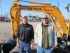 Lynn Brockman (L) and Chris Smith, both of Team Boone, display the dealership’s line of Hyundai machines and Independent breakers.
 