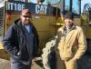 Brett Marsh (L) of Marsh Sand and Gravel and Curtis Jones of Crest Dairy Farm talk about this Cat IT18F loader. 
 