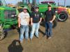 (L-R): T.J., Christian and Alan Banks, all of Banks Farms Inc. in Hillsville, Va., show interest in the John Deere farm equipment.
