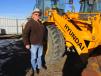 Brad Wade of L&L Machinery, Oberline, Kan., has been checking this Hyundai HL 75T over very carefully. 
