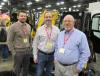 (L-R): Kevin Ray, Michael Burns and Steve Huml, all of Burns JCB, discuss the lineup of JCB machines.