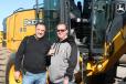 Checking out a John Deere 670G grader are Mike Iapaluccio (L), owner of J. Iapaluccio Incorporated, Danbury, Conn., and Chris Taylor of D&M Construction, also based in Danbury.