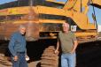 Frank Campbell (L) and Art Martori take a break from the action in front of an older model Caterpillar excavator.  Campbell owns B&J Metals & Materials of Eloy, Ariz., and Martori operates Martori Farms, which has locations throughout Arizona.
 