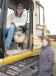 The husband and wife team Kurtis Hoffman (in cab) and Harriett Hoffman of Hoffman Trucking & Excavating, Hopkins, Miss., give a Caterpillar 315BL a thorough inspection. 