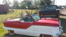 Arriving at the auction in his 1960 Nash Metropolitan is Gayle Fitzpatrick of Fitzpatrick Farms. 
