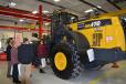 Students take a close-up look at a Komatsu loader before Gov. Herbert introduced Diesel Tech, a program to help students pursue a career in the diesel technology field.
 
