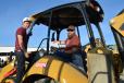 Jamison Riley (L) and Matt Hess of Urban Jungle Contractors, traveled from Boulder City, Nev., to bid on this Cat 420F backhoe loader.
 