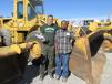 Mark Harris (L) and Luis Fernando Herrera Dres, independent contractors from Springfield, Tenn., are thinking of taking this Cat 966 loader with them to a job they have in Central America. 