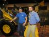 Fred Isabell (L), Mesa County, Colo., and David Middleton of 4Rivers Equipment have been discussing the attributes of the John Deere 324K front-end loader.  