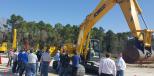 A group of dealer sales professionals gather around KOBELCO’s new Generation 10 SK210 excavator to learn the benefits of its innovative features and technologies.
 
 