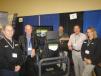 Patten CAT brought in the Cat simulator for customers. (L-R) are Michael Gibson, John Norton, Tony Mattingly and Larry O’neill, all of Patten CAT and Michelle Elam of Simformotion LLC.
 